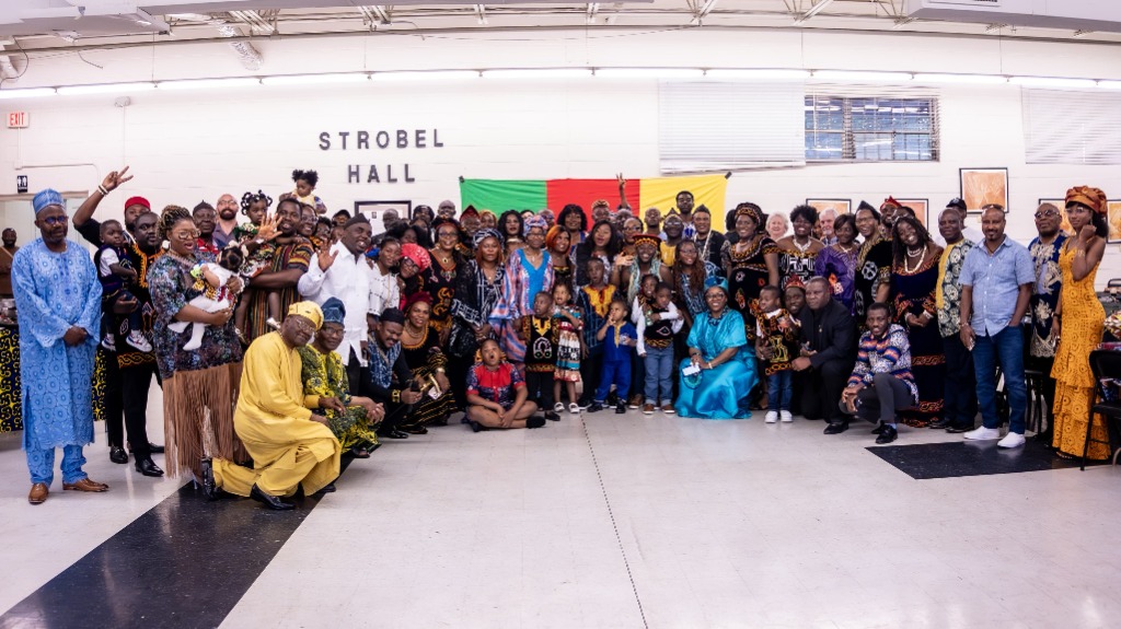 A large group of Cameroon Community in Middle Tennessee members posing together in front of Strobel Hall